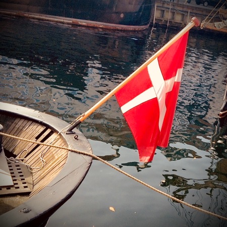 Boat and Danish flag seen in Nyhavn, Copenhagen